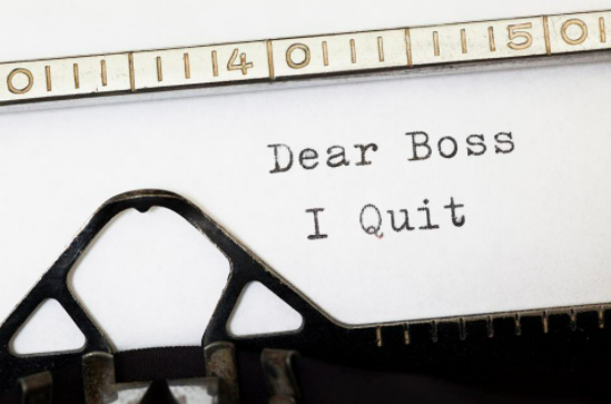 "Dear Boss I Quit" typed on paper inside typewriter