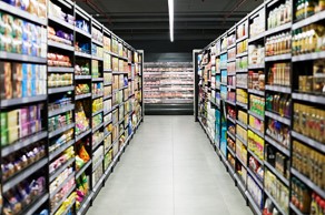 Non-perishable foods stacked in a grocery aisle