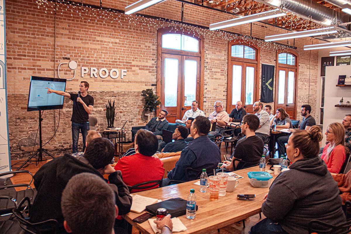 Group listening to person holding a seminar; employee trust concept