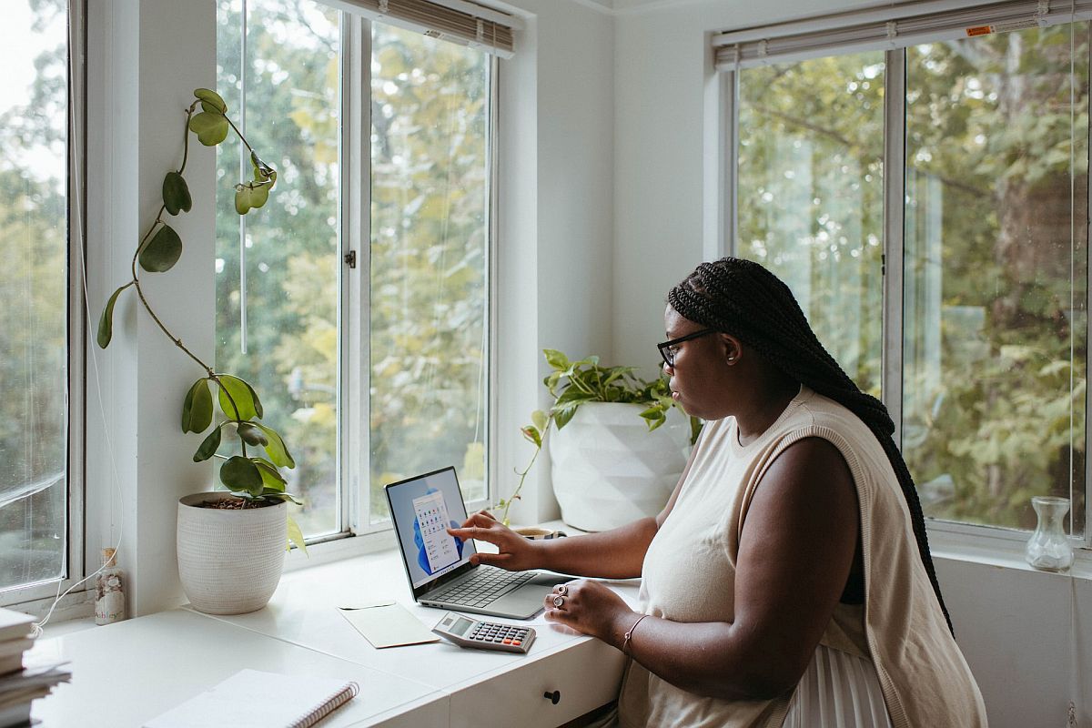 Woman working from home on her laptop; effective rewards concept