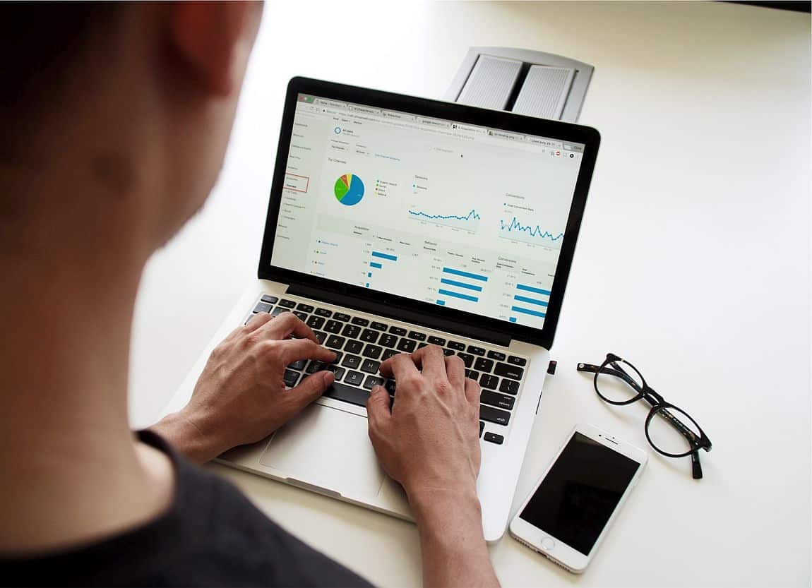 close-up, hands on a laptop which displays a pie chart; rewards visibility concept