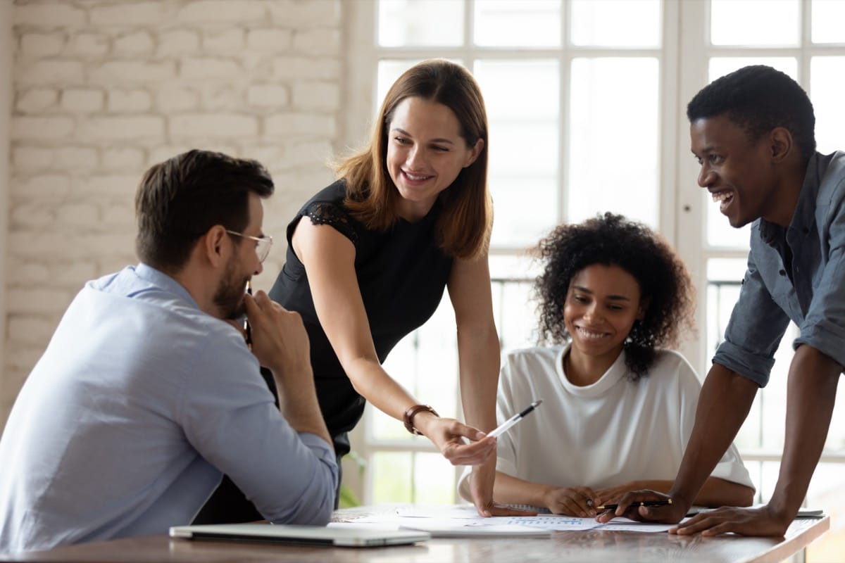 Team leader teach workers at corporate group briefing; Recruitment and Total Reward concept