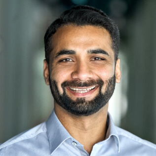 Bearded man smiling at camera